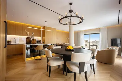 a kitchen and dining room with a table and chairs at The Athenian Luxury Penthouse by GK Properties in Athens