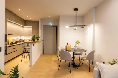 a kitchen and dining room with a table and chairs at Rooms151 Smart Suite in the Heart of Athens 1st floor-2B in Athens