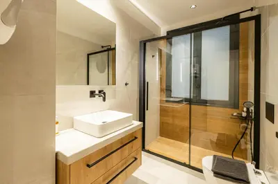 a bathroom with a sink and a shower at Rooms151 Smart Suite in the Heart of Athens 1st floor-2B in Athens