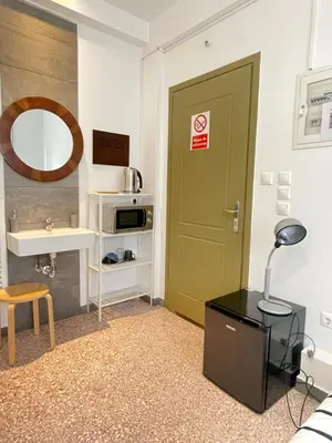 a bathroom with a green door and a sink at Circle Mirror Center Inn in Athens