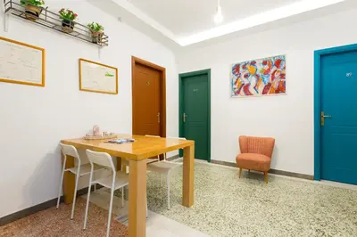 a dining room with blue and green doors at Circle Mirror Center Inn in Athens