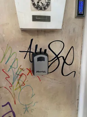 a wall with graffiti on it with a radio on it at Cozy Apartment View Pasalimani in Piraeus