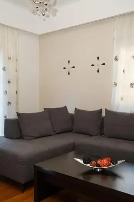 a living room with a couch and a table at Apartment near Acropolis in Athens