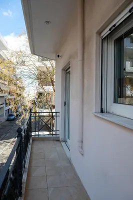 a balcony of a building with a window at Apartment near Acropolis in Athens
