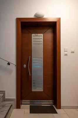 a wooden door with a sign on top of it at Apartment near Acropolis in Athens