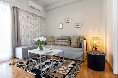 a living room with a couch and a table at Kosmos Serenity - 1BR, Neos Kosmos in Athens