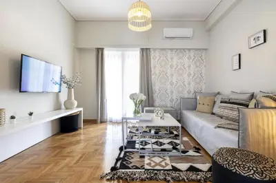 a living room with a couch and a table at Kosmos Serenity - 1BR, Neos Kosmos in Athens