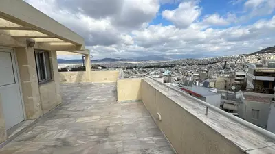 a balcony with a view of a city at Mania's Studio by Lycabetus in Athens