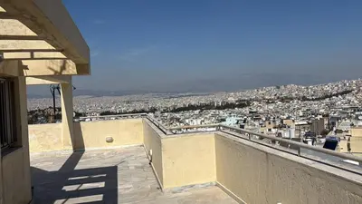 a view of a city from the balcony of a house at Mania's Studio by Lycabetus in Athens