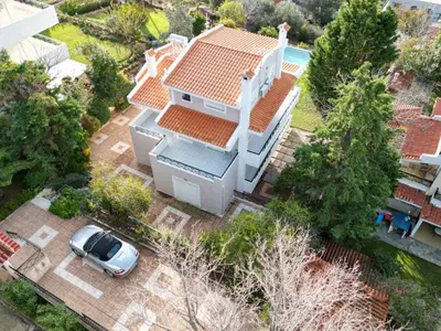 an aerial view of a house with a car in the driveway at Villa Leonidas in Anavissos