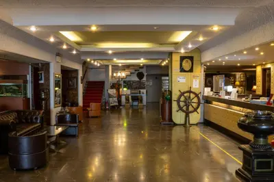 a lobby of a restaurant with a bar at Cavo D' Oro in Piraeus