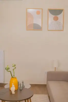 a living room with a orange vase on a table at Exarcheia's Bliss in Athens