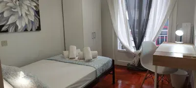 a bedroom with a bed and a desk and a window at Vintage Apartment Athens Center 6BD-2BATH in Athens