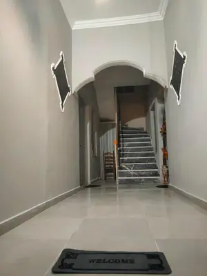 a hallway with a welcome mat on the floor at Central Piraeus port apartment in Piraeus