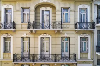 a building with windows and balconies on it at Marvelous apartment in Plaka in Athens