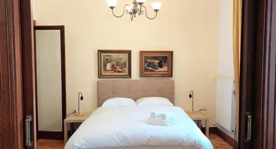 a bedroom with a bed with two stuffed animals on it at Marvelous apartment in Plaka in Athens