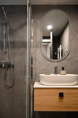 a bathroom with a sink and a mirror at New 2BR apt in Kallithea in Athens