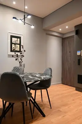 a dining room with a table and two chairs at New 2BR apt in Kallithea in Athens