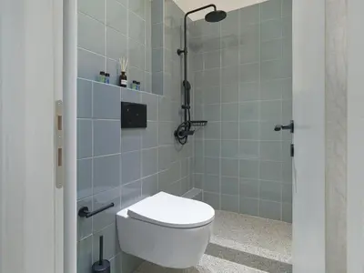 a bathroom with a toilet and a shower at Amanita Athens Iridanou apartment in Athens