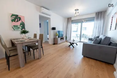 a living room with a table and a couch at Waylink Residences - Marina Floisvou - Z4 in Athens