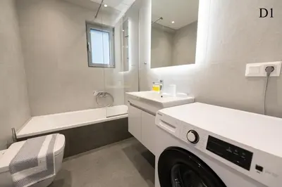 a washing machine in a bathroom with a sink and a tub at Waylink Residences - Marina Floisvou - Z4 in Athens