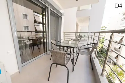 a balcony with a table and chairs on it at Waylink Residences - Marina Floisvou - Z4 in Athens