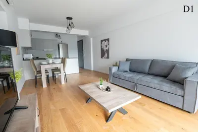 a living room with a couch and a table at Waylink Residences - Marina Floisvou - Z4 in Athens