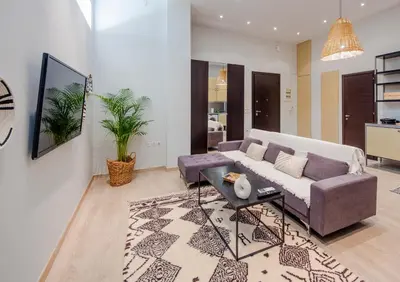 a living room with a couch and a table at K8 Syntagma in Athens
