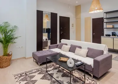a living room with a couch and a table at K8 Syntagma in Athens