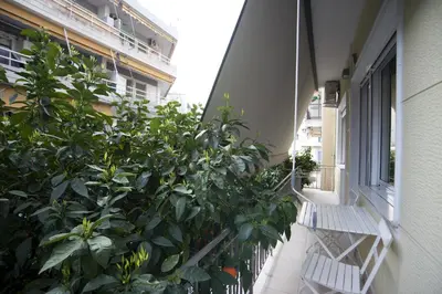 a balcony with plants on the side of a building at Bellissimo Ctr Stylish Reno 2BR Apt near Acropolis in Athens