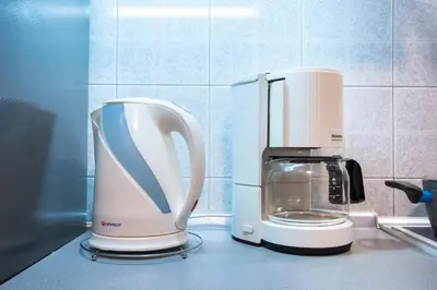 a coffee maker sitting on top of a kitchen counter at Modern Apartment near City center in Athens