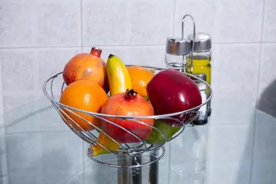 a bowl of fruit on a glass table at Modern Apartment near City center in Athens
