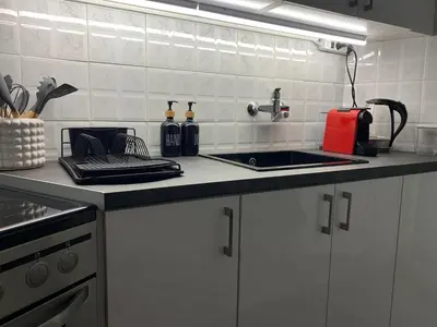 a kitchen with a sink and a counter top at Quiet apartment in Athens