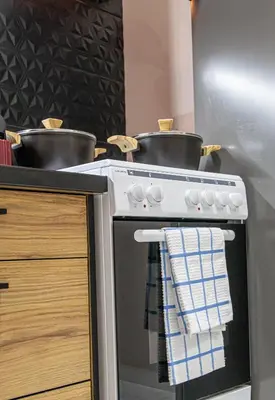 a kitchen with two pots on top of a stove at Stephan's Modern Apartment in Athens