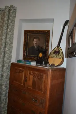 a portrait of a man on a dresser with a guitar at Pythagoras Omonoia in Athens