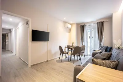 a living room with a couch and a table at Elegant Aphrodite, 2 Bedroom Apartment, by Acropolin in Athens
