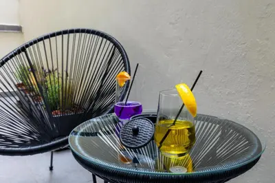 a glass of wine and a glass of orange juice on a table at Athens Center Retreat in Athens