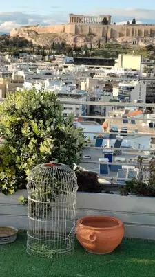 a view of a city from a balcony at Pythagoras Acropolis in Athens