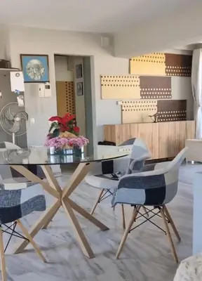 a dining room with a glass table and two chairs at Pythagoras Acropolis in Athens