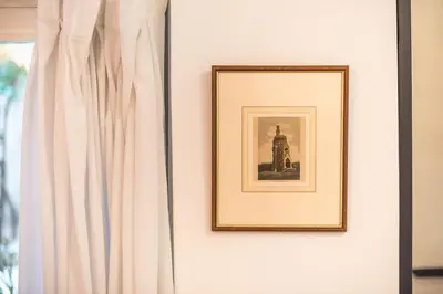 a picture on a wall next to a curtain at Zen Lotus, Kolonaki in Athens