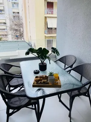 a tray of food on a table on a balcony at New Modern 2BD aprt with shared rooftop pool B2 in Athens