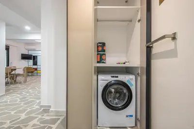 a washer and dryer sitting in a room at Zen Orchid, Kolonaki in Athens