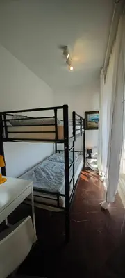 a room with two bunk beds and a window at Luxury 2bdr apartment with sea view and 50m from the beach in Porto Rafti
