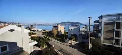 a view of a street in a city with buildings at Luxury 2bdr apartment with sea view and 50m from the beach in Porto Rafti