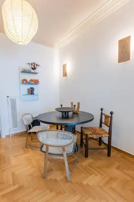 a dining room with a table and chairs at Ernesto Apartment in Athens