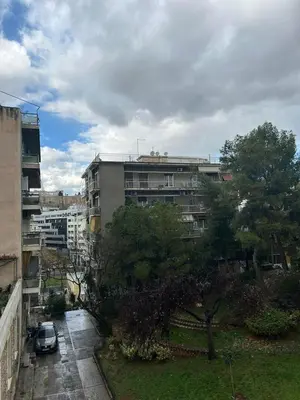 a car parked in front of a building at Piece of Gold 7 minutes from Acropolis in Athens