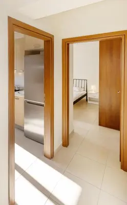 a kitchen with a refrigerator and a room with a bed at Urban Oasis with Acropolis Views by GHH in Athens