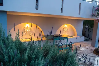a building with two domes with christmas trees on it at Lili and Blue - Charming house in Porto Rafti