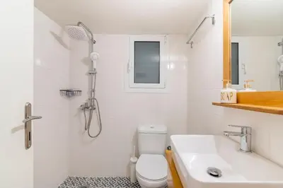 a bathroom with a shower and a toilet and a sink at Bee Home - Apartment in Kypseli Central Athens in Athens