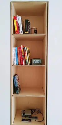a book shelf with many books on it at Bee Home - Apartment in Kypseli Central Athens in Athens